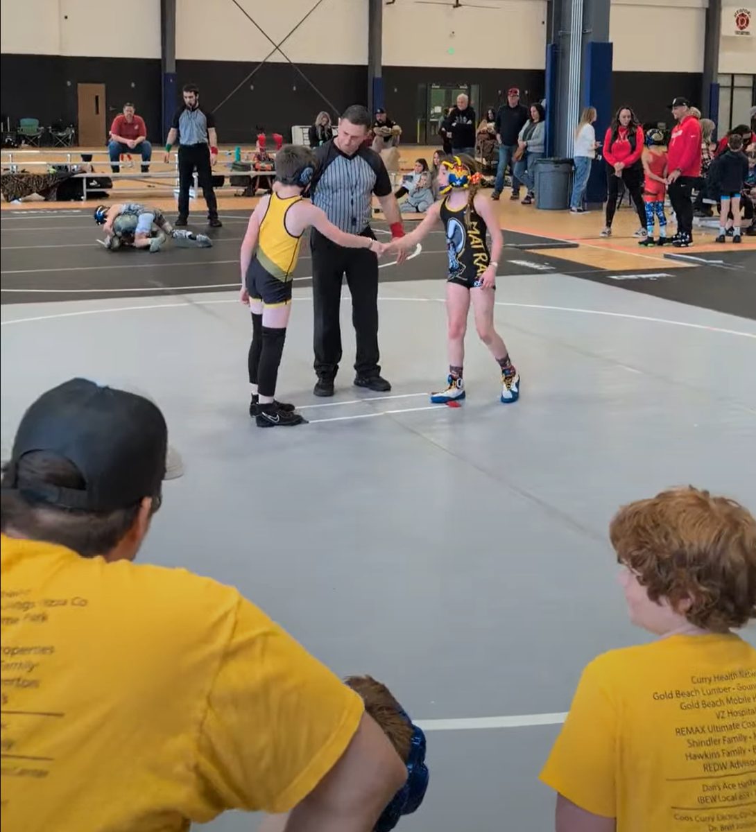 Wrestler and coach at practice